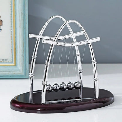 Desktop Newton's Cradle.  Add a sophisticated flare to your workspace!