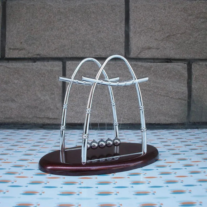 Desktop Newton's Cradle.  Add a sophisticated flare to your workspace!